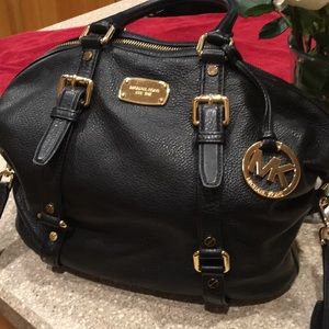 Black and gold authentic Michael kors purse